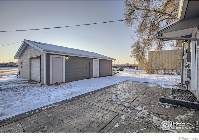 view of snow covered garage