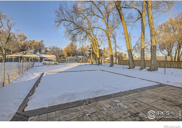 view of yard layered in snow