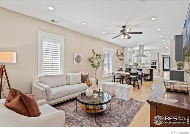 119 N Shields St, Fort Collins, CO 80521 - living room featuring light hardwood / wood-style floors and ceiling fan