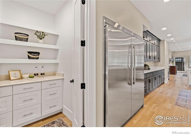 119 N Shields St, Fort Collins, CO 80521 - kitchen with light hardwood / wood-style flooring and built in refrigerator