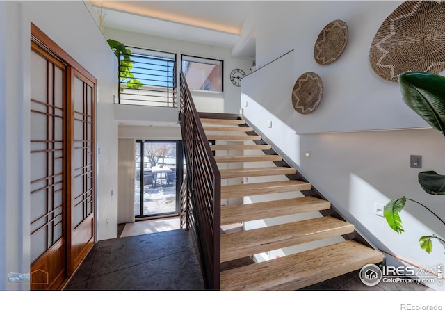 stairs with french doors