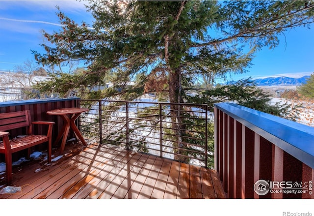 wooden terrace featuring a mountain view