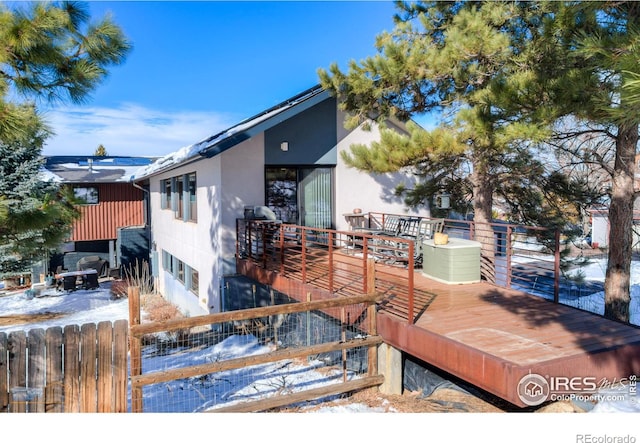 view of snow covered deck