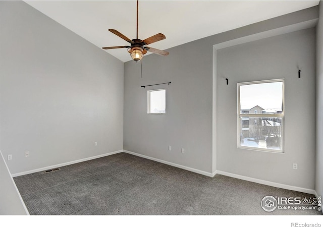 carpeted spare room with ceiling fan