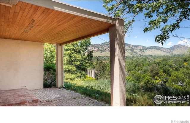 view of patio / terrace with a mountain view