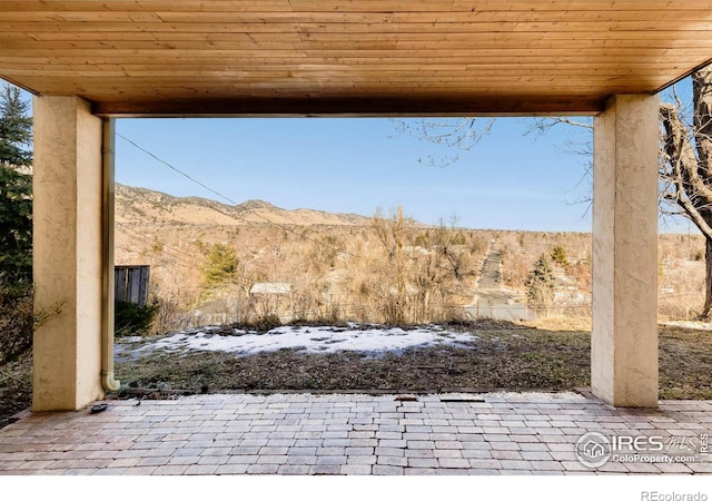 view of patio / terrace with a mountain view