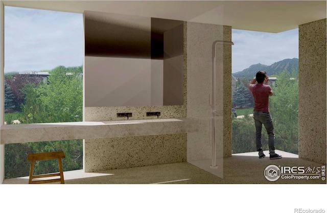 bathroom featuring a mountain view