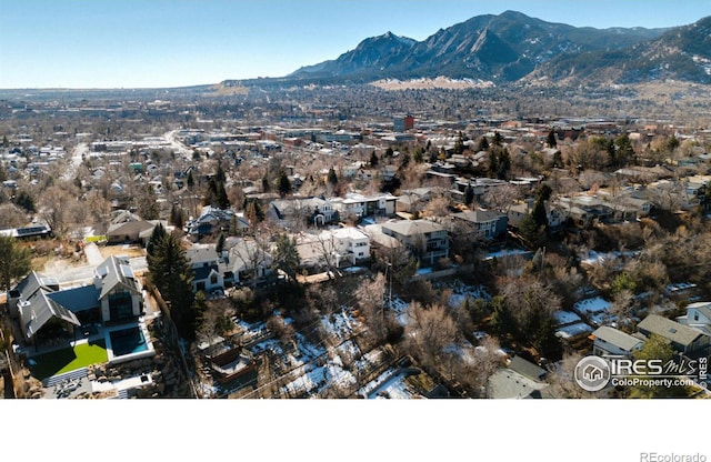 birds eye view of property with a mountain view