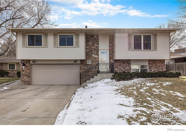 raised ranch featuring a garage