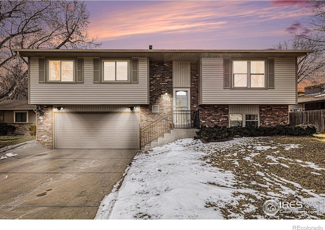 raised ranch featuring a garage