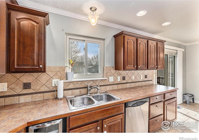 kitchen with tasteful backsplash, stainless steel dishwasher, crown molding, and sink