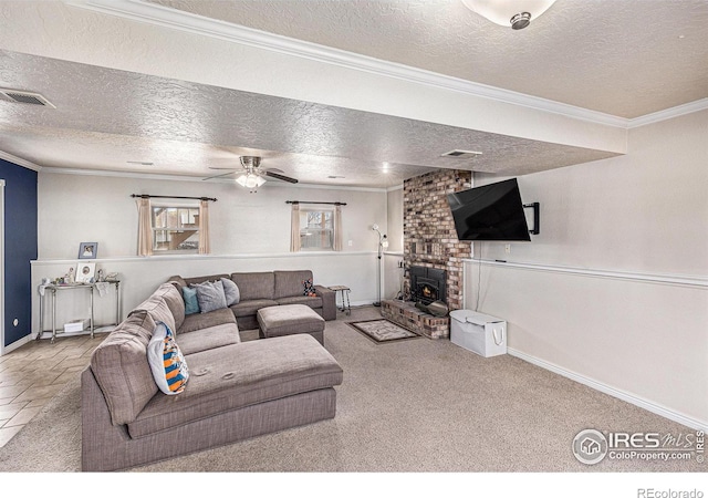 carpeted living room with crown molding, ceiling fan, and a textured ceiling