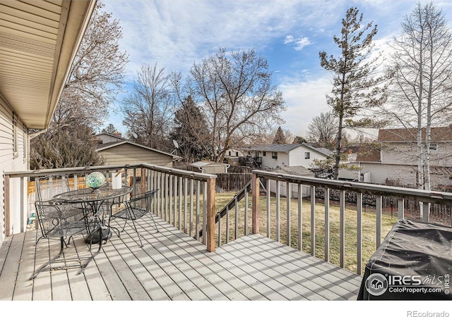 wooden deck with a yard