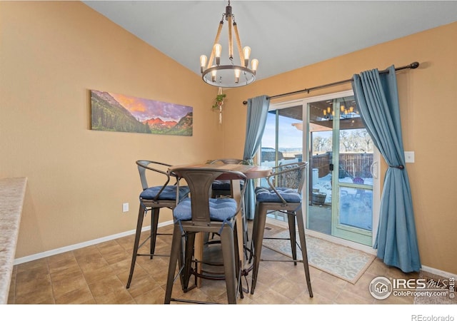 dining room featuring lofted ceiling and a notable chandelier