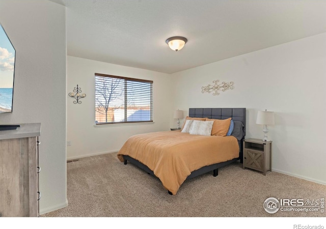 bedroom with light carpet