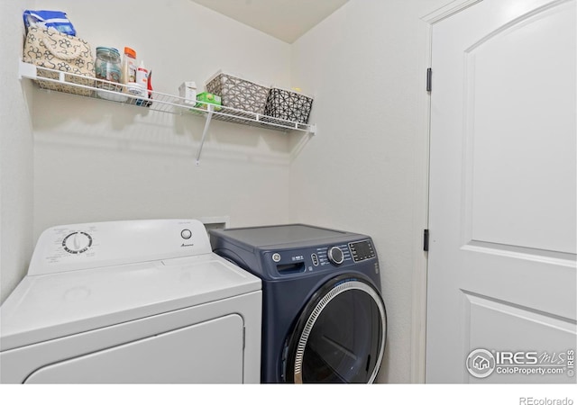 laundry room featuring separate washer and dryer