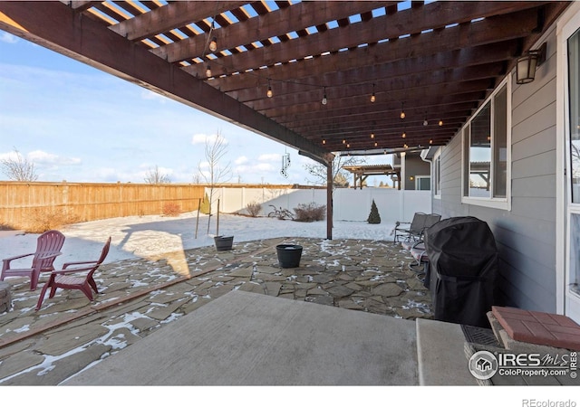 view of patio / terrace with grilling area and a pergola