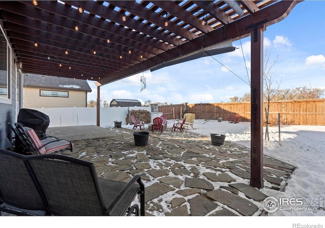 view of patio featuring area for grilling and a pergola