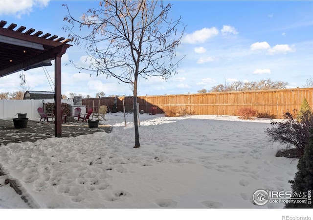 view of yard covered in snow