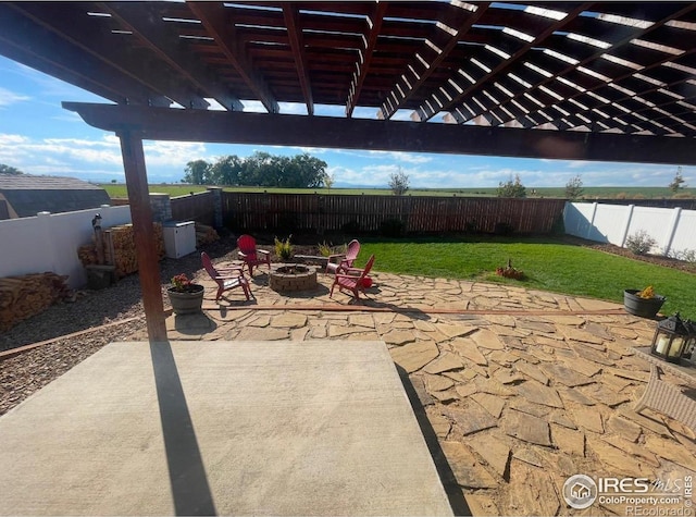 view of patio featuring a pergola and an outdoor fire pit