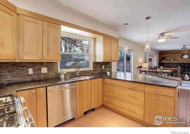 kitchen featuring pendant lighting, dishwasher, sink, backsplash, and kitchen peninsula