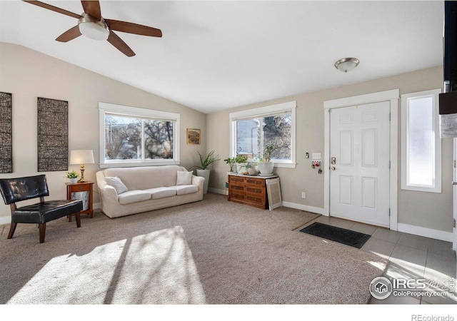 living room with vaulted ceiling and light colored carpet