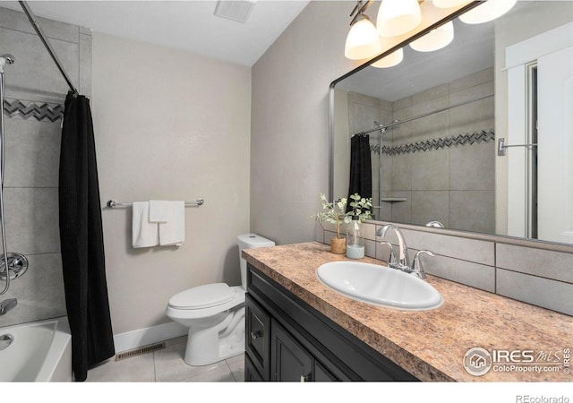 full bathroom with tile patterned floors, toilet, shower / tub combo, and vanity