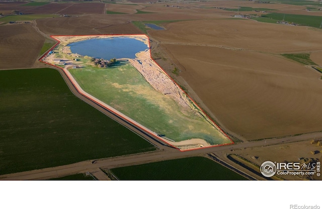 drone / aerial view featuring a rural view and a water view