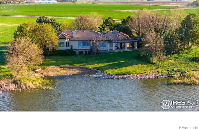 aerial view with a rural view and a water view