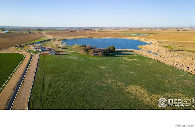 bird's eye view with a water view and a rural view