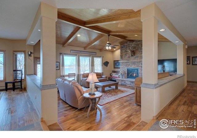 living room with lofted ceiling with beams, wood-type flooring, wood ceiling, and a fireplace