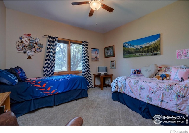 carpeted bedroom featuring ceiling fan