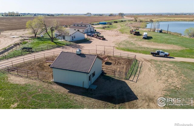 birds eye view of property featuring a rural view and a water view