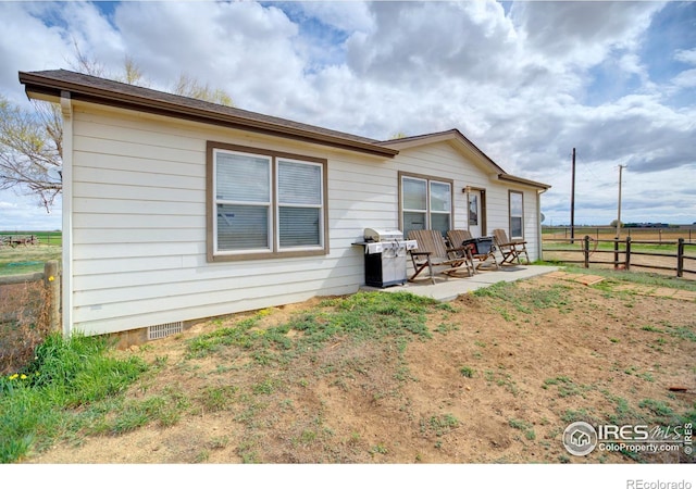 rear view of house with a patio