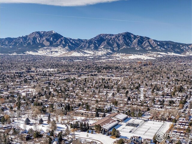 snowy aerial view featuring a mountain view