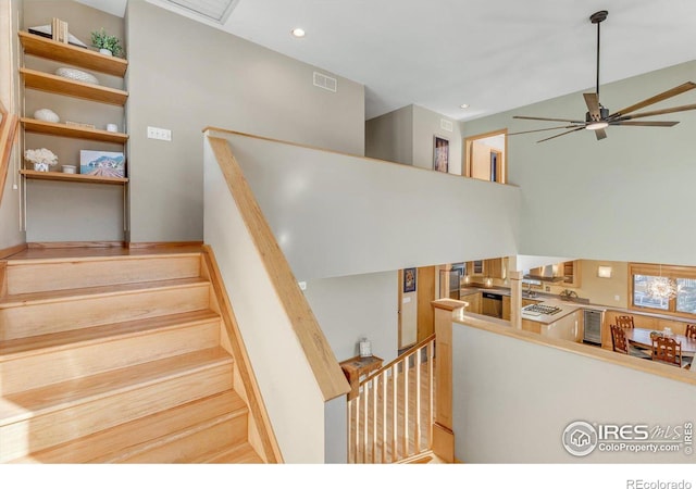 staircase featuring recessed lighting, visible vents, and a ceiling fan