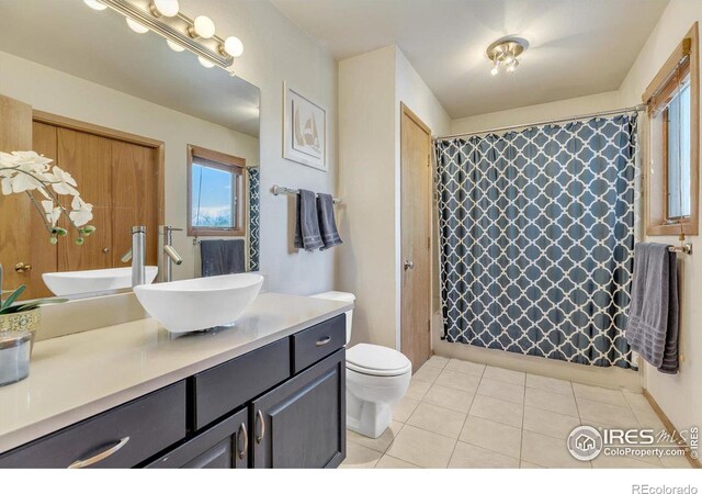 full bathroom with vanity, tile patterned flooring, toilet, and a shower with curtain