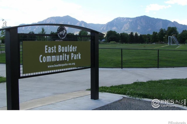 exterior space with fence and a mountain view