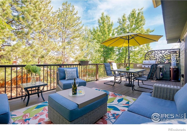 wooden deck with an outdoor living space and a grill