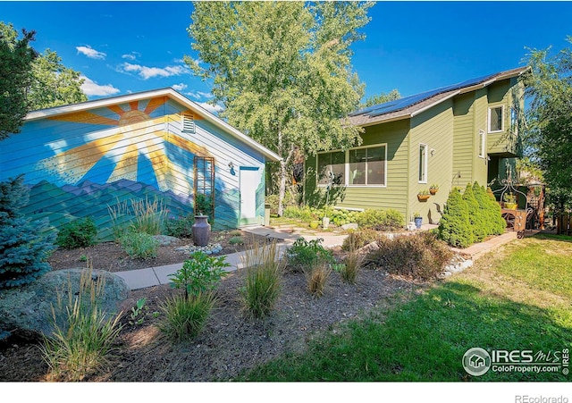 view of front of home with solar panels