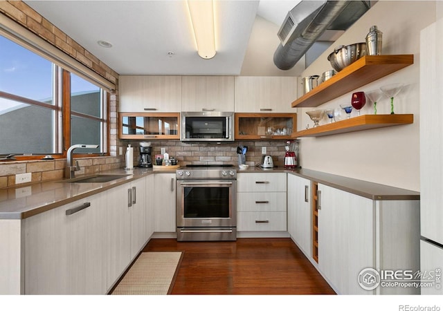 kitchen featuring decorative backsplash, dark wood-style floors, appliances with stainless steel finishes, open shelves, and a sink