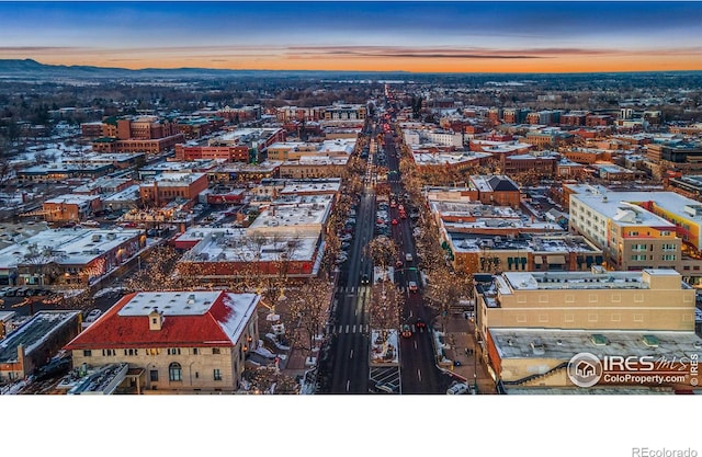 aerial view at dusk featuring a view of city