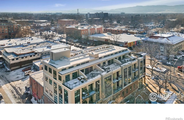 birds eye view of property with a mountain view