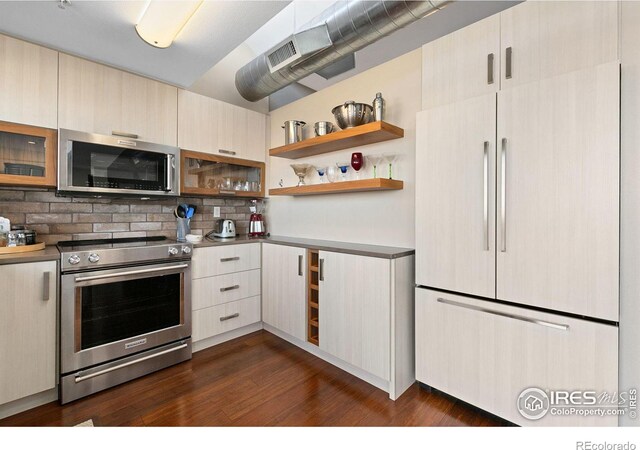 kitchen with modern cabinets, appliances with stainless steel finishes, dark wood-type flooring, open shelves, and backsplash