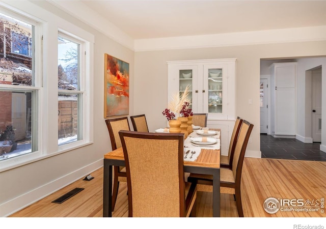 dining room with dark hardwood / wood-style floors