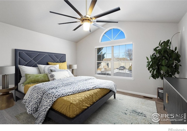 bedroom featuring ceiling fan, carpet flooring, and vaulted ceiling