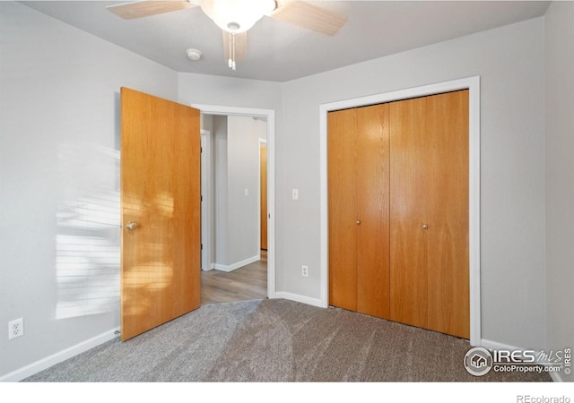 unfurnished bedroom featuring ceiling fan, carpet flooring, and a closet