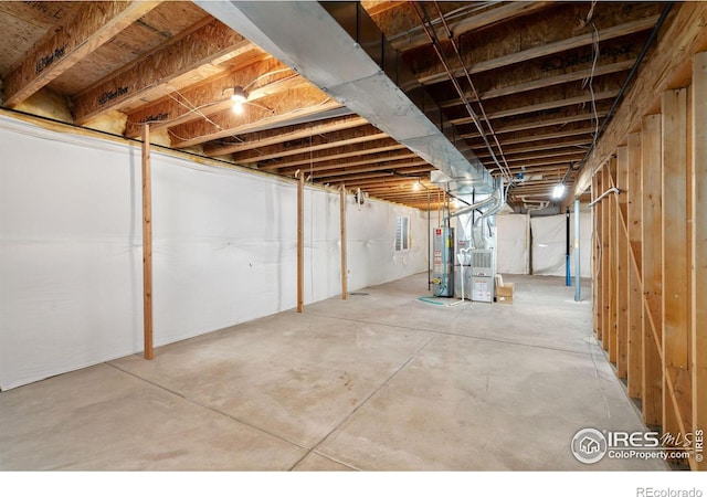 basement with gas water heater and heating unit