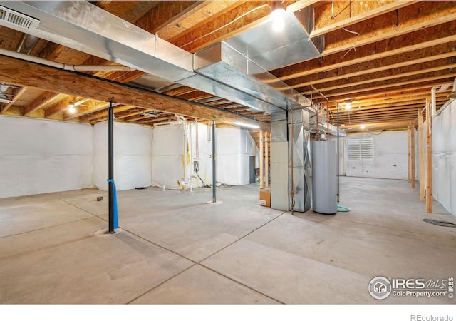 basement with gas water heater and heating unit