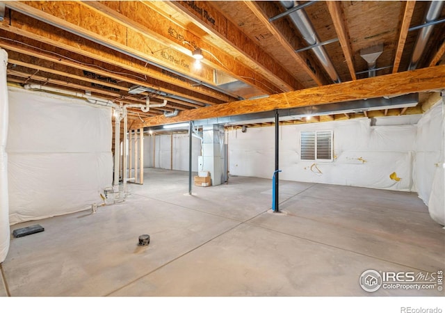 basement featuring heating unit